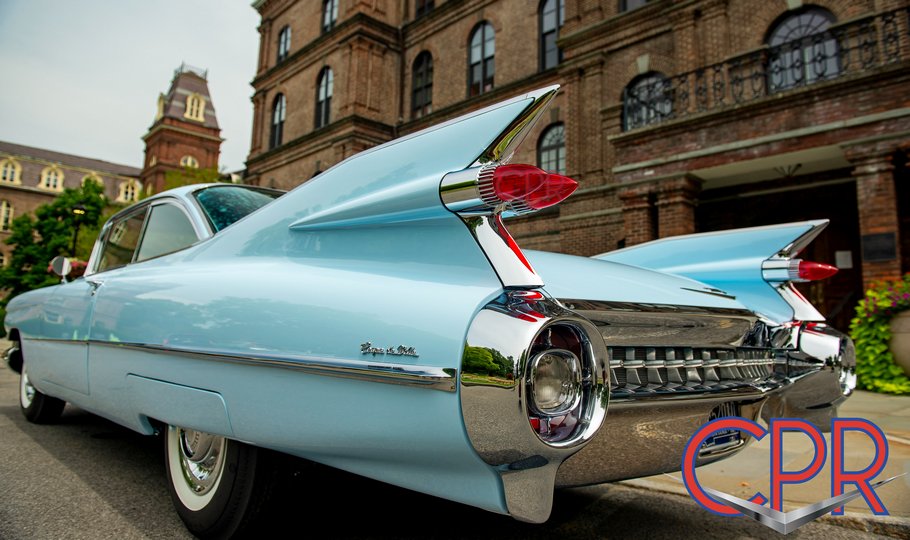 Tailfin view of a restored 1959 Cadillac in Breton Blue